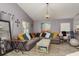 Living room showcasing a neutral sectional sofa with decorative pillows, modern lighting, and plank flooring at 5826 Taywood Dr, Tampa, FL 33624