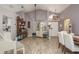 Open-concept living room with vaulted ceilings, modern lighting, and stylish furnishings at 5826 Taywood Dr, Tampa, FL 33624