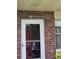 Unit 26 front door features brick accents and secure access with a clear view at 5865 37Th N Ave # 26, St Petersburg, FL 33710