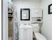 Classic bathroom with vanity, and framed mirror at 6682 Mauna Loa Blvd, Sarasota, FL 34241