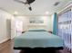 Bedroom featuring hardwood floors and sliding glass doors at 6682 Mauna Loa Blvd, Sarasota, FL 34241
