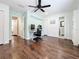 Bedroom showcasing wood floors, ceiling fan, and bright, neutral paint at 6682 Mauna Loa Blvd, Sarasota, FL 34241