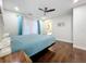 Bedroom featuring hardwood floors, a ceiling fan, and curtains at 6682 Mauna Loa Blvd, Sarasota, FL 34241