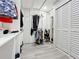 Walk-in closet features storage solutions and bi-fold doors at 6682 Mauna Loa Blvd, Sarasota, FL 34241