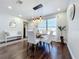 Cozy dining space with wood floors and access to a backyard view at 6682 Mauna Loa Blvd, Sarasota, FL 34241