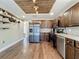 Spacious kitchen with stainless steel appliances, wooden cabinetry, and an island at 6682 Mauna Loa Blvd, Sarasota, FL 34241