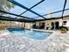 Picturesque swimming pool and patio featuring a screened enclosure for year-round enjoyment at 6682 Mauna Loa Blvd, Sarasota, FL 34241