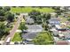A stunning aerial view showcases the property's location, surrounded by mature trees, providing a peaceful residential setting at 710 W Peninsular St, Tampa, FL 33603