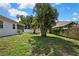 Spacious back yard featuring beautiful landscaping and a well-maintained lawn, perfect for outdoor activities and relaxation at 710 W Peninsular St, Tampa, FL 33603