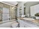 Stylishly renovated bathroom featuring a shower-tub combination and modern fixtures creates a spa-like retreat at 710 W Peninsular St, Tampa, FL 33603