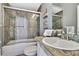 Stylishly renovated bathroom featuring a shower-tub combination and modern fixtures creates a spa-like retreat at 710 W Peninsular St, Tampa, FL 33603
