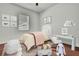 Cozy bedroom with a twin bed, white furnishings, and decorative decor at 710 W Peninsular St, Tampa, FL 33603
