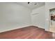 Bedroom featuring hardwood floors, a closet, and an en-suite bathroom at 710 W Peninsular St, Tampa, FL 33603