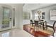 Open-concept dining room adjacent to the foyer, featuring a modern light fixture and natural light at 710 W Peninsular St, Tampa, FL 33603