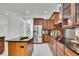 Well-equipped kitchen with stainless steel appliances, granite countertops, and ample cabinet space at 710 W Peninsular St, Tampa, FL 33603