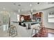 Modern kitchen featuring pendant lighting, a glass countertop bar, and sleek cabinetry at 710 W Peninsular St, Tampa, FL 33603