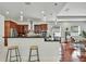 Open kitchen with stainless steel appliances, pendant lights, and a countertop bar for seating at 710 W Peninsular St, Tampa, FL 33603