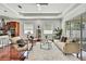 Inviting living room featuring hardwood floors, a comfortable seating area, and plenty of natural light at 710 W Peninsular St, Tampa, FL 33603