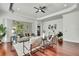 Open living room showcasing hardwood floors, a seating area, and seamless access to outdoor living at 710 W Peninsular St, Tampa, FL 33603
