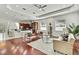 Expansive living space open to kitchen, features hardwood floors, and a comfortable seating arrangement at 710 W Peninsular St, Tampa, FL 33603