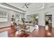 Bright living room with hardwood floors, neutral decor, and sliding glass doors to outdoor space at 710 W Peninsular St, Tampa, FL 33603