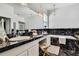 Bathroom showcasing marble accents, a soaking tub, vanity area and elegant lighting at 710 W Peninsular St, Tampa, FL 33603