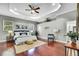 Serene main bedroom boasts hardwood floors, a tray ceiling, and a soothing color palette at 710 W Peninsular St, Tampa, FL 33603