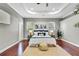 Comfortable main bedroom showcasing hardwood floors, natural light, and a tranquil atmosphere at 710 W Peninsular St, Tampa, FL 33603