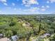 An aerial view of a neighborhood with lush trees and homes in a quaint neighborhood setting at 7219 4Th N Ave, St Petersburg, FL 33710