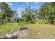 Large backyard with lush plantings, garden beds, and a well-maintained lawn at 7219 4Th N Ave, St Petersburg, FL 33710