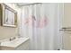 Bathroom with a vanity and a bright flamingo shower curtain at 7219 4Th N Ave, St Petersburg, FL 33710