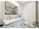 Remodeled bathroom featuring a tile shower, marble countertop, and a modern vanity at 7219 4Th N Ave, St Petersburg, FL 33710