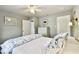 Bright bedroom with a ceiling fan, closet, and neutral wall paint at 7219 4Th N Ave, St Petersburg, FL 33710