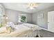 Well-lit bedroom offering a ceiling fan, nice flooring, and natural light at 7219 4Th N Ave, St Petersburg, FL 33710