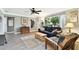 Cozy living room featuring hardwood floors, a comfortable sofa, and natural light at 7219 4Th N Ave, St Petersburg, FL 33710