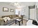 The living room features light gray walls, a couch, and mounted television at 7219 4Th N Ave, St Petersburg, FL 33710