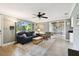 Bright living room with a large window and hardwood floors and view of dining area at 7219 4Th N Ave, St Petersburg, FL 33710
