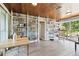 Spacious living room with wood ceiling, built-in bookshelves, and bright natural light from the windows at 7219 4Th N Ave, St Petersburg, FL 33710