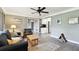 Open-concept space with hardwood floors connecting the living room, dining area, and kitchen at 7219 4Th N Ave, St Petersburg, FL 33710
