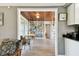 Inviting living room with wood-paneled ceiling, built-in bookshelves, and a view to the exterior porch area at 7219 4Th N Ave, St Petersburg, FL 33710