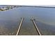 Aerial view of long docks extending into open water at 7705 4Th W Ave, Bradenton, FL 34209