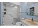 Bathroom with a glass-enclosed shower, grab bars, and a neutral vanity at 7705 4Th W Ave, Bradenton, FL 34209