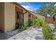 Home exterior featuring well-maintained landscaping and a patio at 7705 4Th W Ave, Bradenton, FL 34209