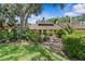 Charming one-story home with a manicured lawn and mature trees at 7705 4Th W Ave, Bradenton, FL 34209