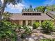 Charming home featuring a well-manicured yard, earthy paint color and a unique clerestory window at 7705 4Th W Ave, Bradenton, FL 34209