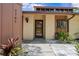 A home featuring a well-manicured front yard and a welcoming entrance at 7705 4Th W Ave, Bradenton, FL 34209