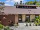 Inviting home featuring a private fenced courtyard and beautiful mature landscaping at 7705 4Th W Ave, Bradenton, FL 34209