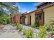 Inviting home featuring a private entrance and beautiful mature landscaping at 7705 4Th W Ave, Bradenton, FL 34209