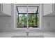 Kitchen window with view to backyard and ample natural light at 7705 4Th W Ave, Bradenton, FL 34209