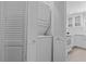 Laundry closet with stacked washer and dryer, maximizing space at 7705 4Th W Ave, Bradenton, FL 34209